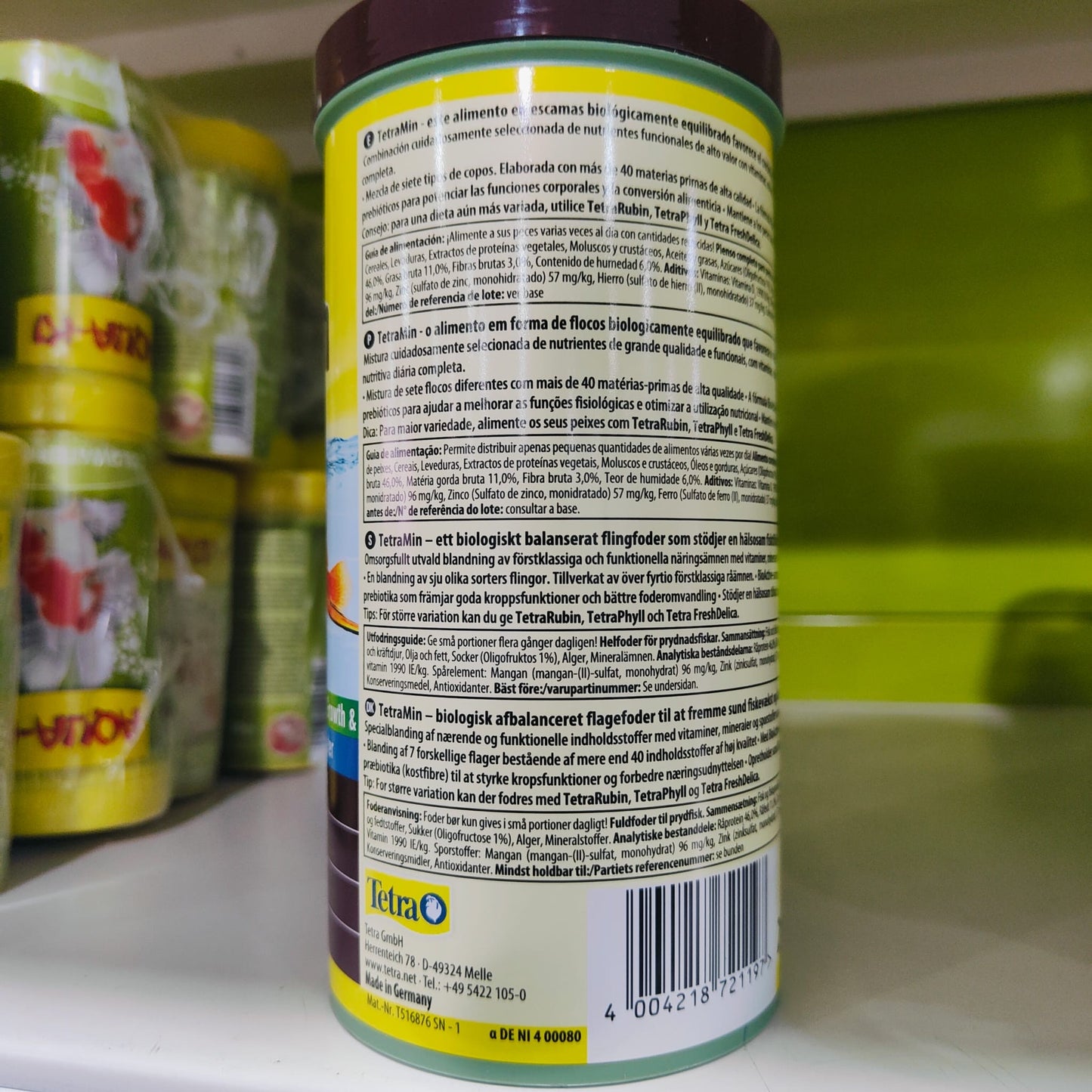 TETRAMIN 100 ML. (Escamas)  Alimento premium completo.